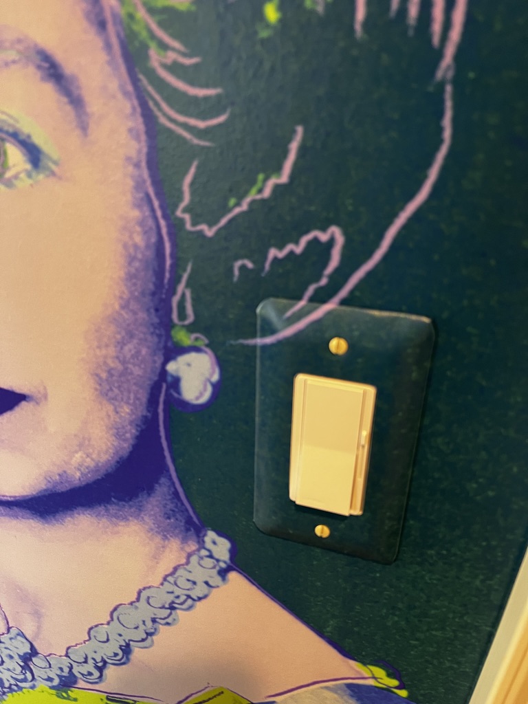 precise wallpaper cut around light switch