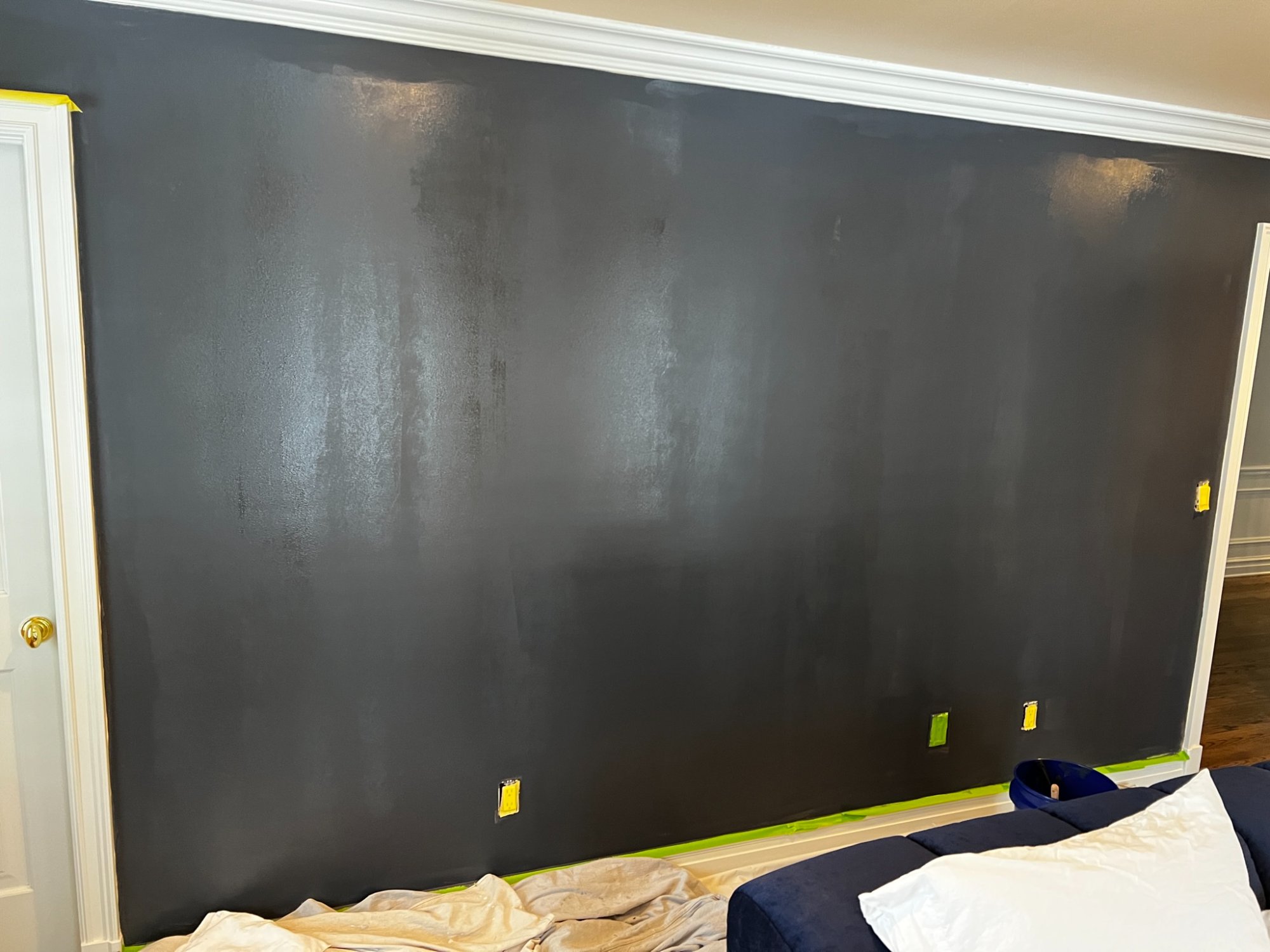 dark tinted primer applied for wallpaper prep