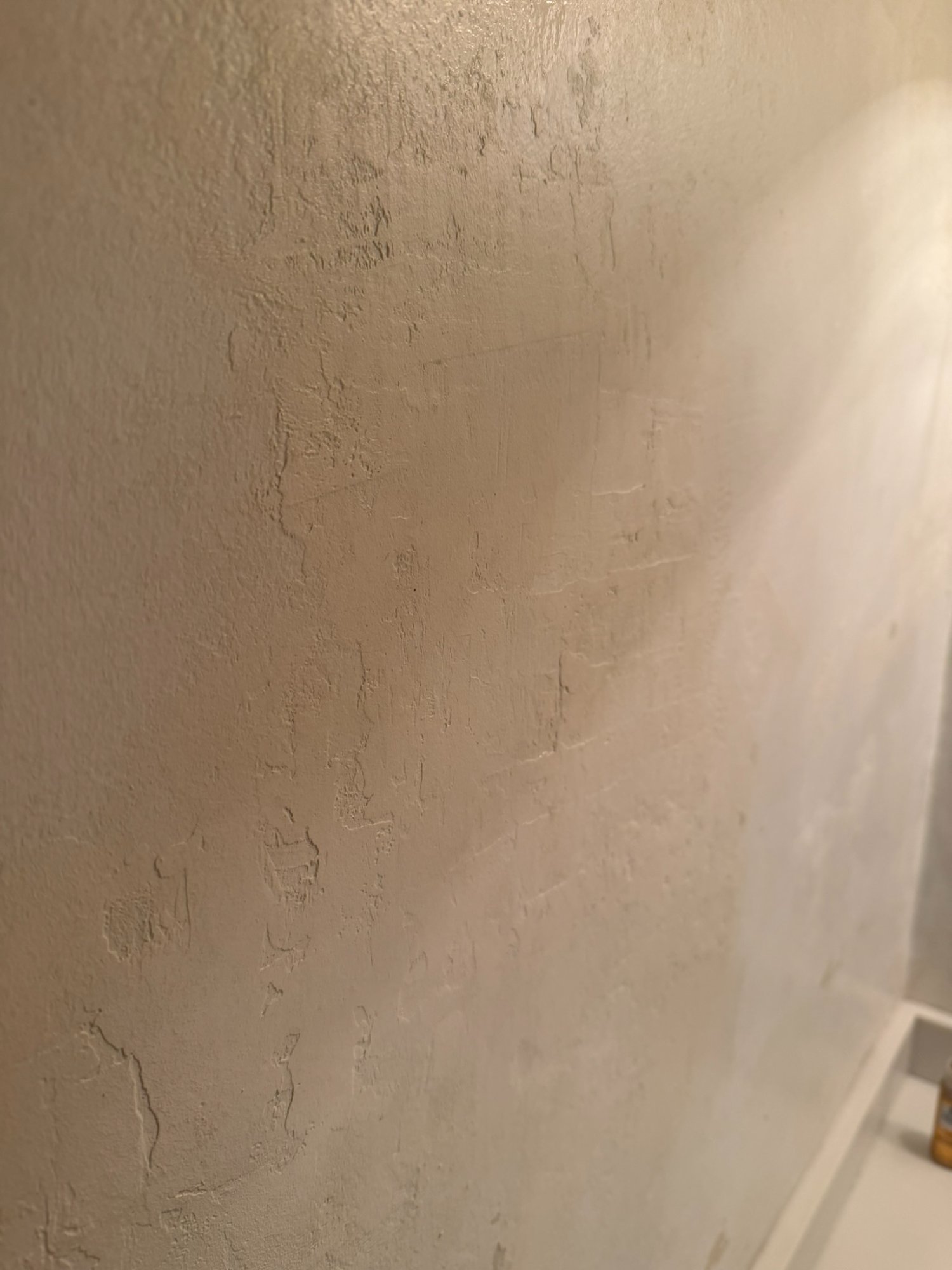 wallpaper installer prep - rough textured wall needing work before hiring a wallpaper installer