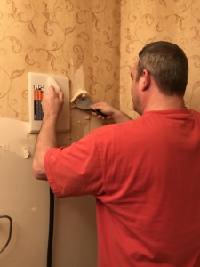 Barry Bernau using a Wagner wallpaper steamer on a difficult wallpaper removal job
