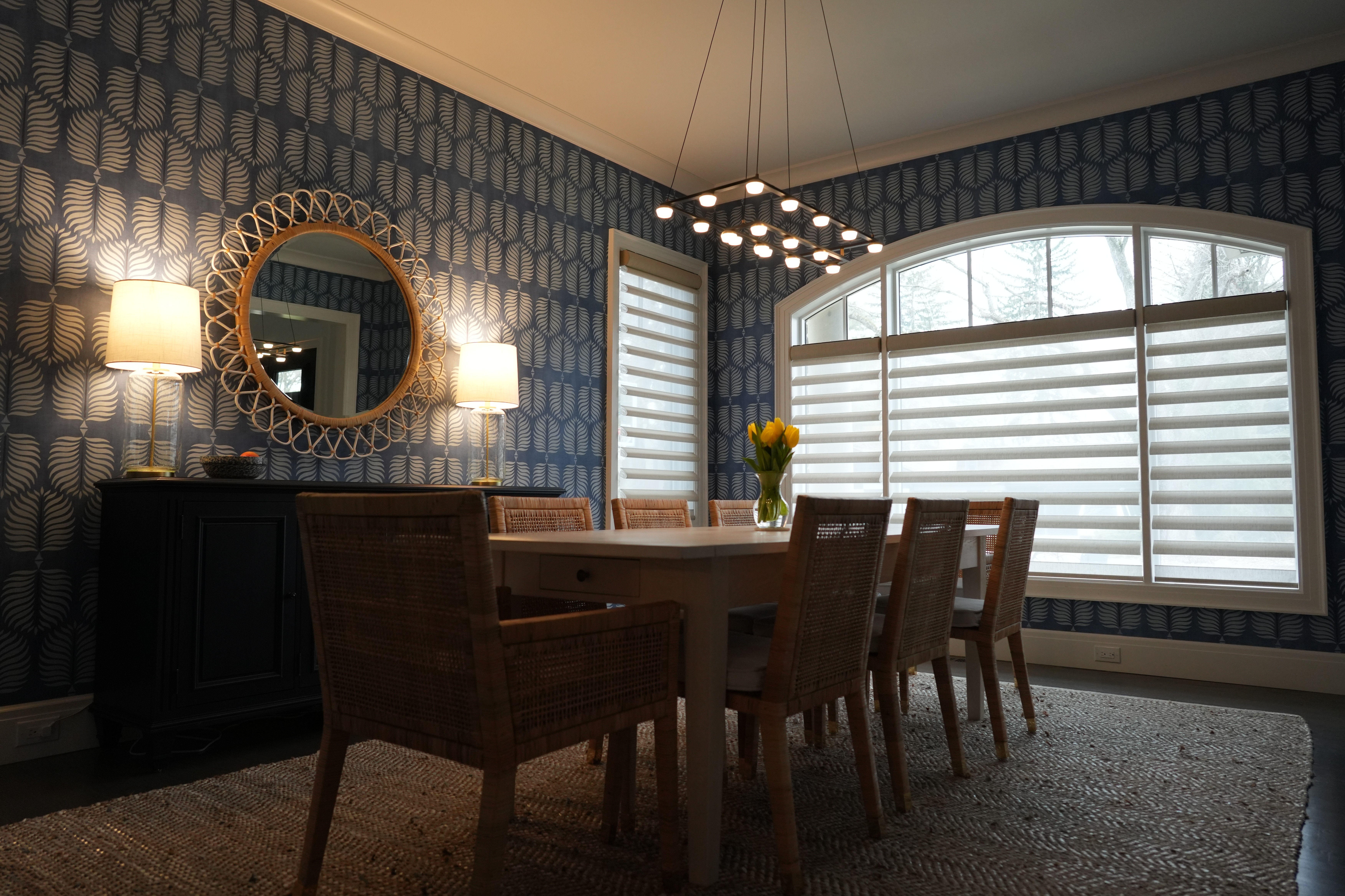 Deep navy Serena & Lily Granada wallpaper in a Birmingham dining room, professionally installed by Bernau Designs.