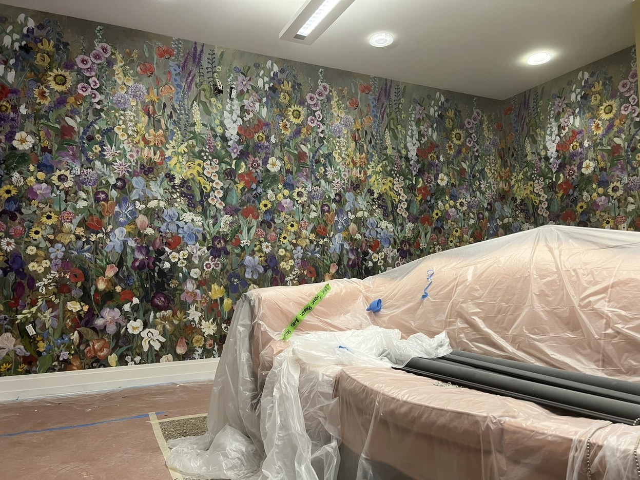 Painterly wildflower meadow House of Hackney wallpaper covering a commercial wall at GlamJail in Birmingham, Michigan.
