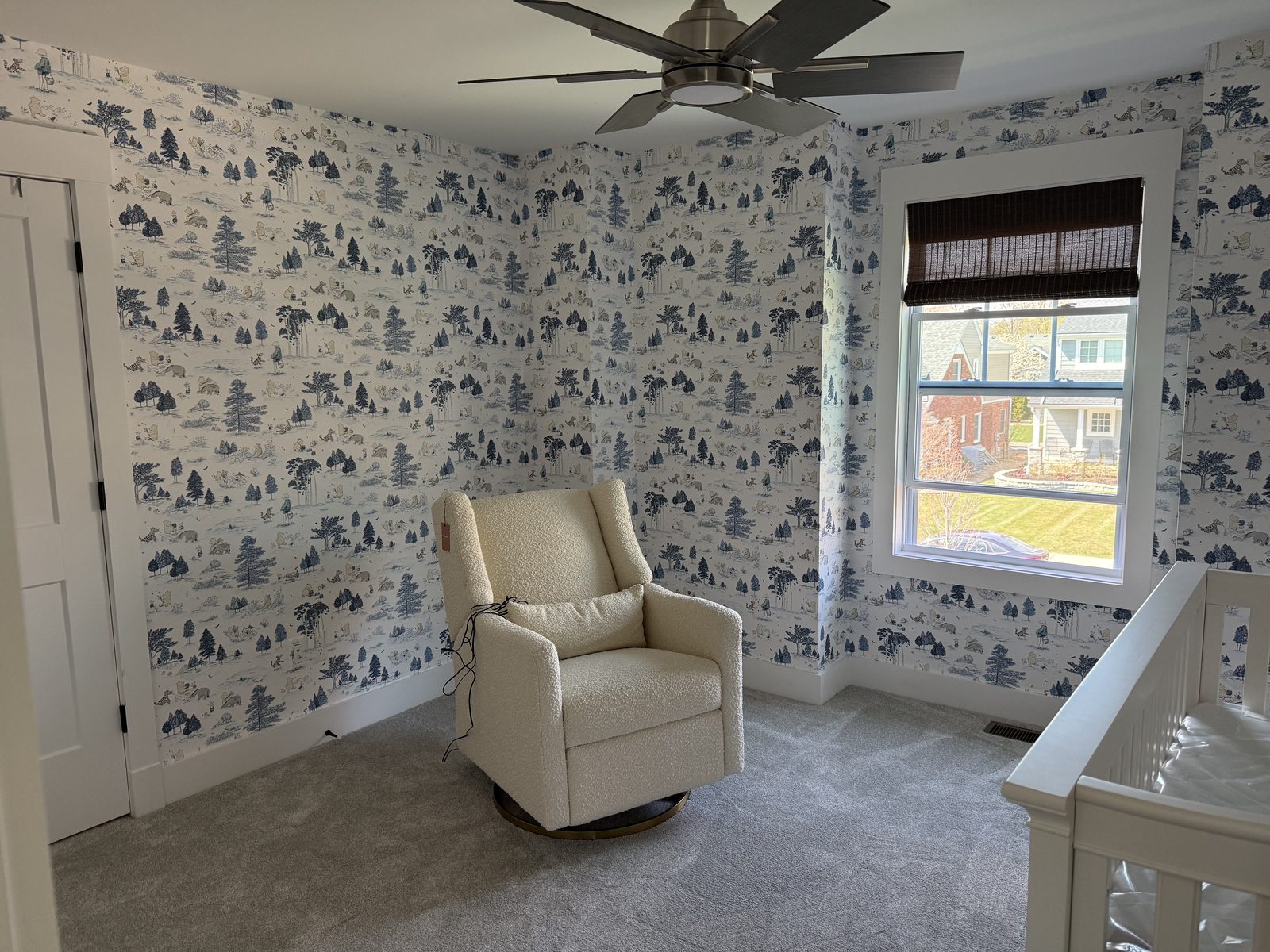 Sanderson Winnie the Pooh Bonbon Blue wallpaper installed on four walls of a nursery in Plymouth, Michigan.