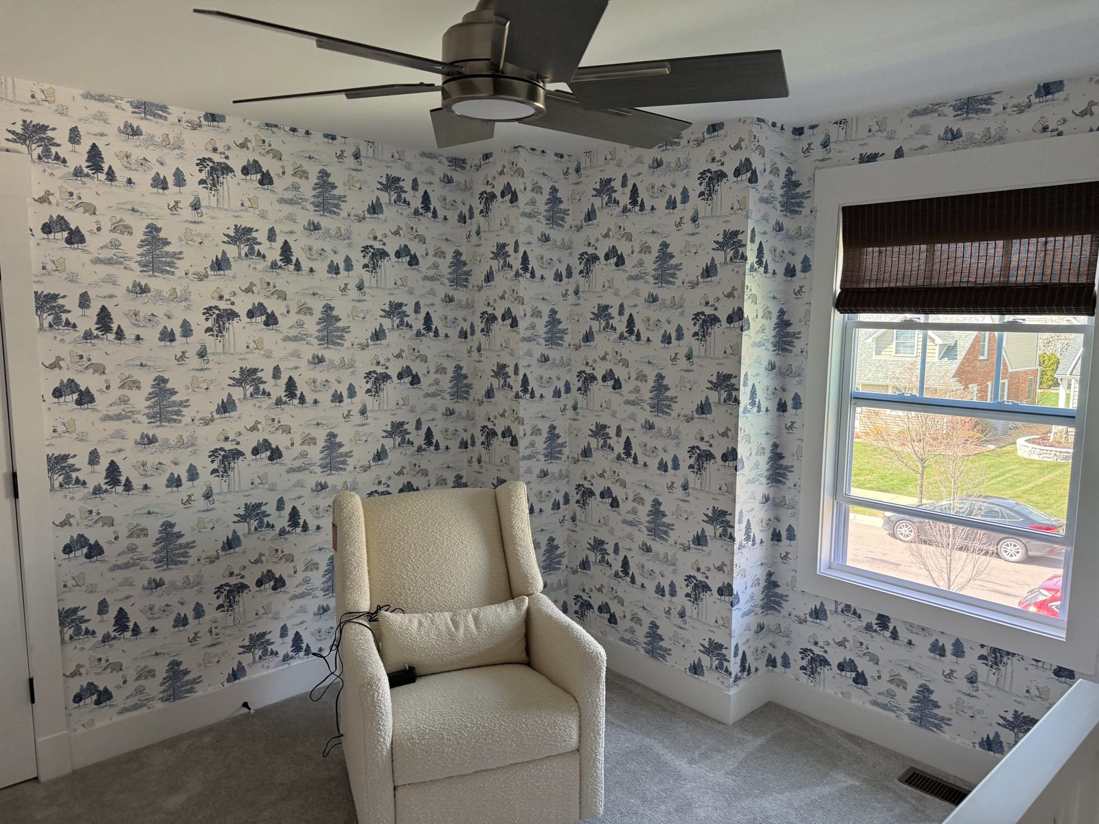 Room-scale view of Sanderson Winnie the Pooh wallpaper in Bonbon Blue in a Plymouth, Michigan nursery.